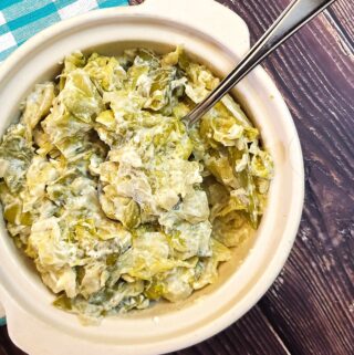 Close up of butter braised cabbage and sugar snap peas.