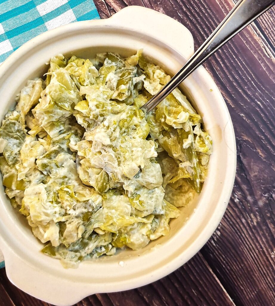 Close up of butter braised cabbage and sugar snap peas.