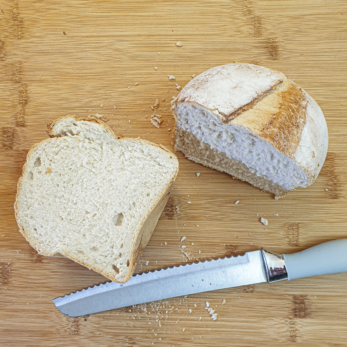 A small farmhouse loaf of bread cut in half.