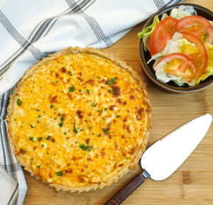 Overhead shot of a cheese and onion quiche.