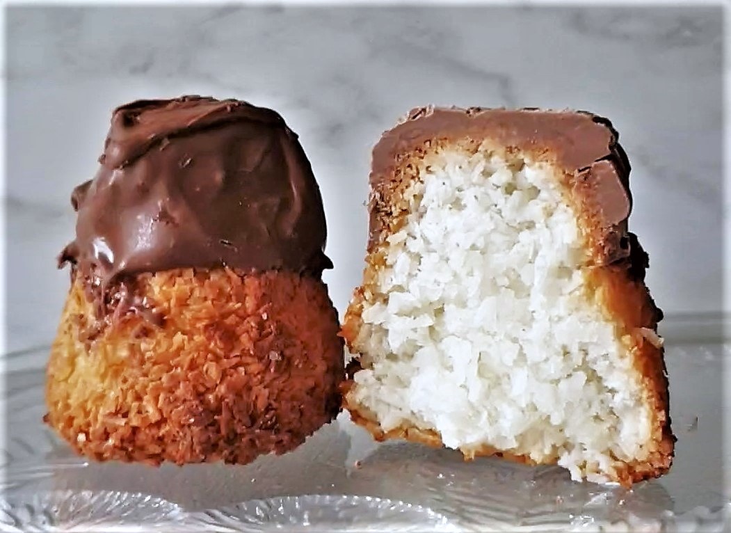 A coconut macaroon cut in half to show the inside.