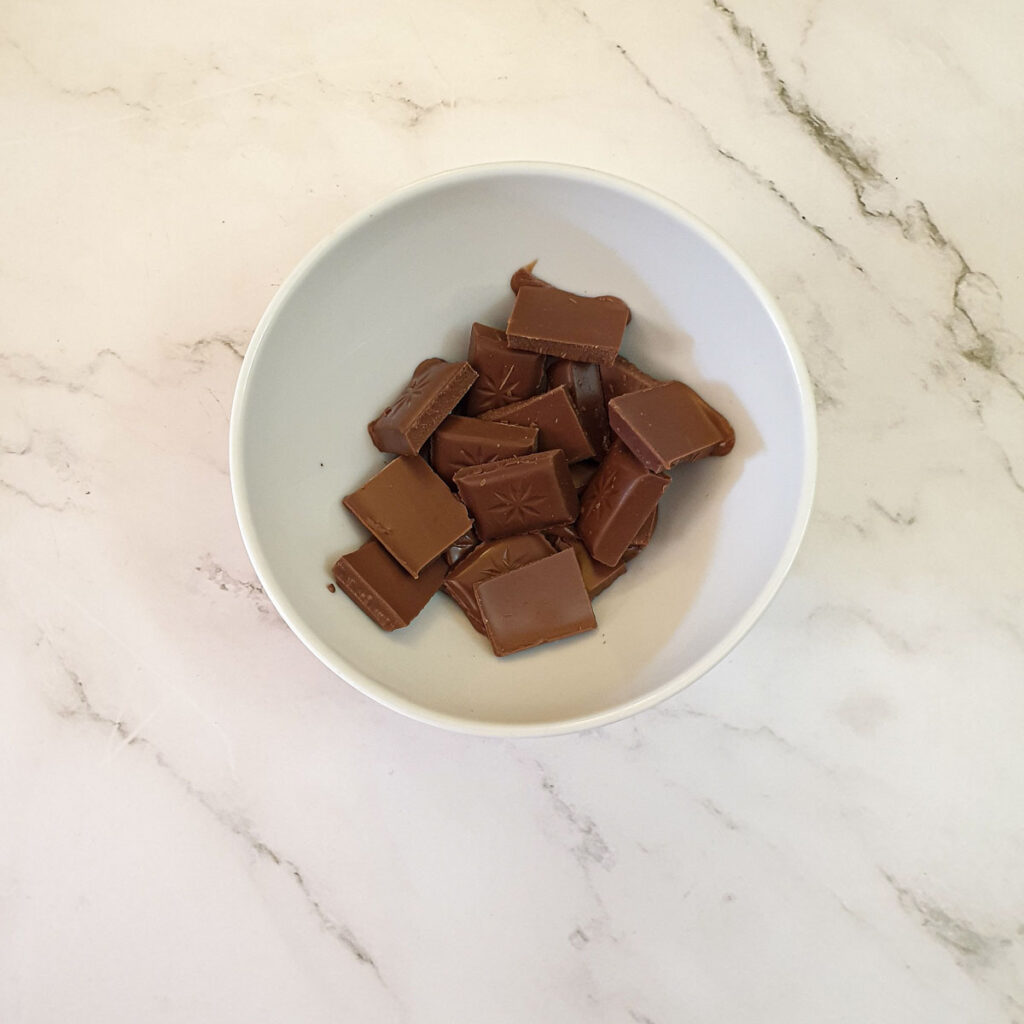 Pieces of chocolate in a bowl.