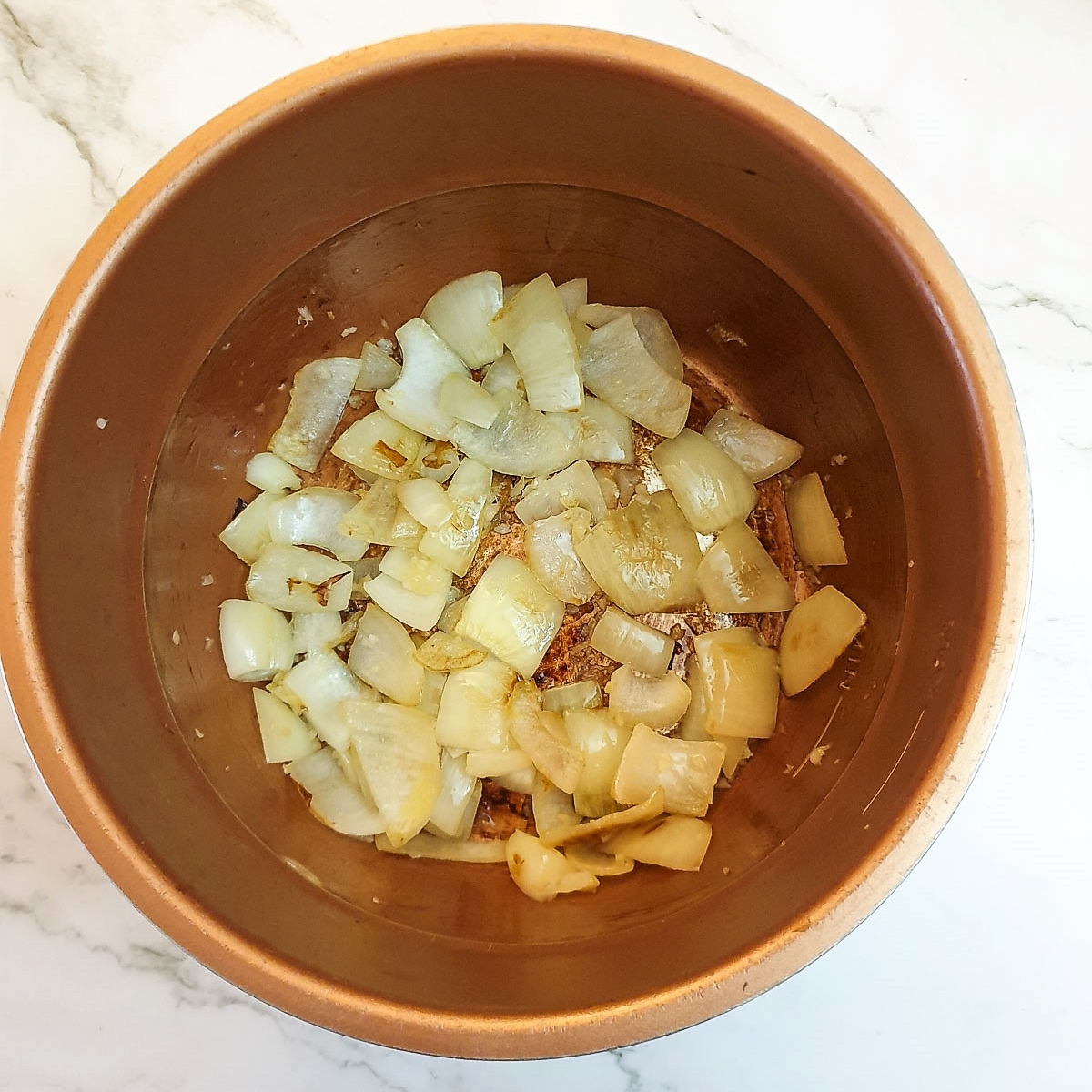 Onions frying in a presssure cooker.