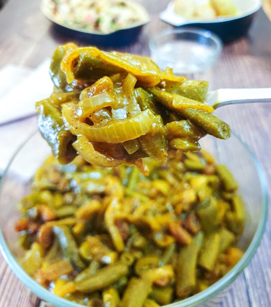 Overhead shot of a dish of curried green beans.