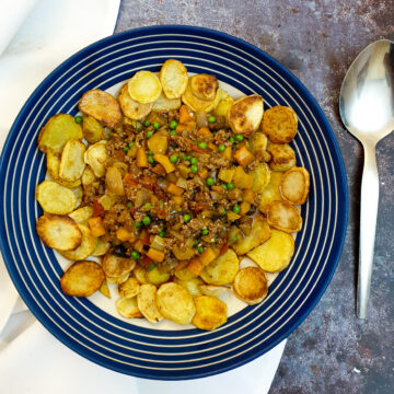 Crispy fried sliced potatoes surrounding a pile of savoury minced beef and vegetables.