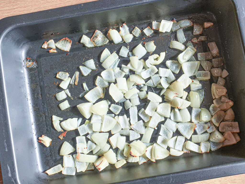 Onions baked in a roasting pan.