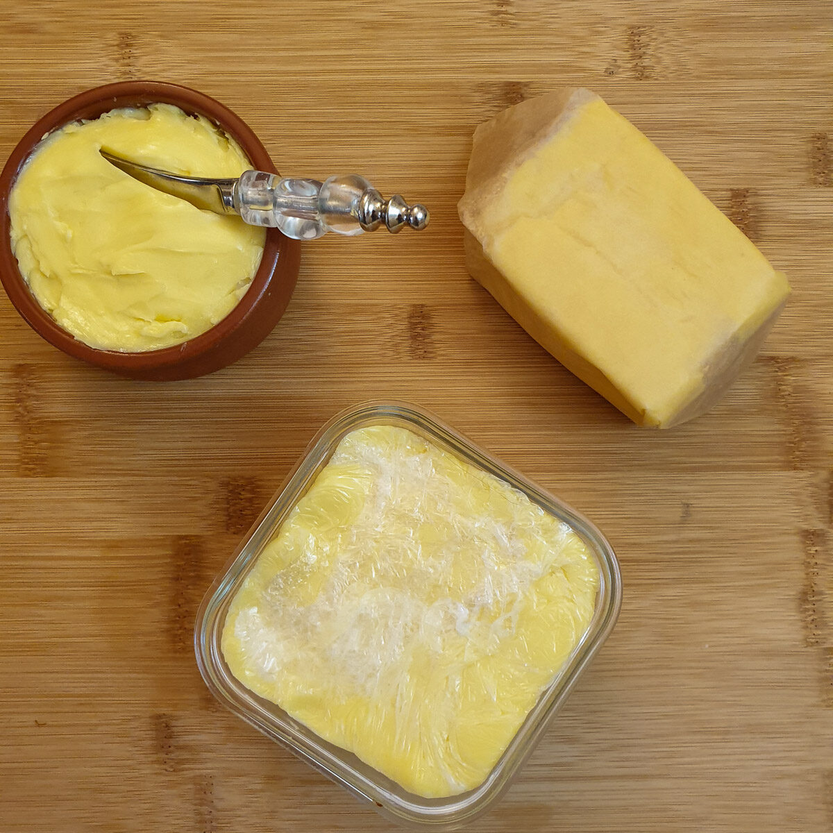 Homemade butter in a ramekin, wrapped in greaseproof paper and wrapped in clingfilm.