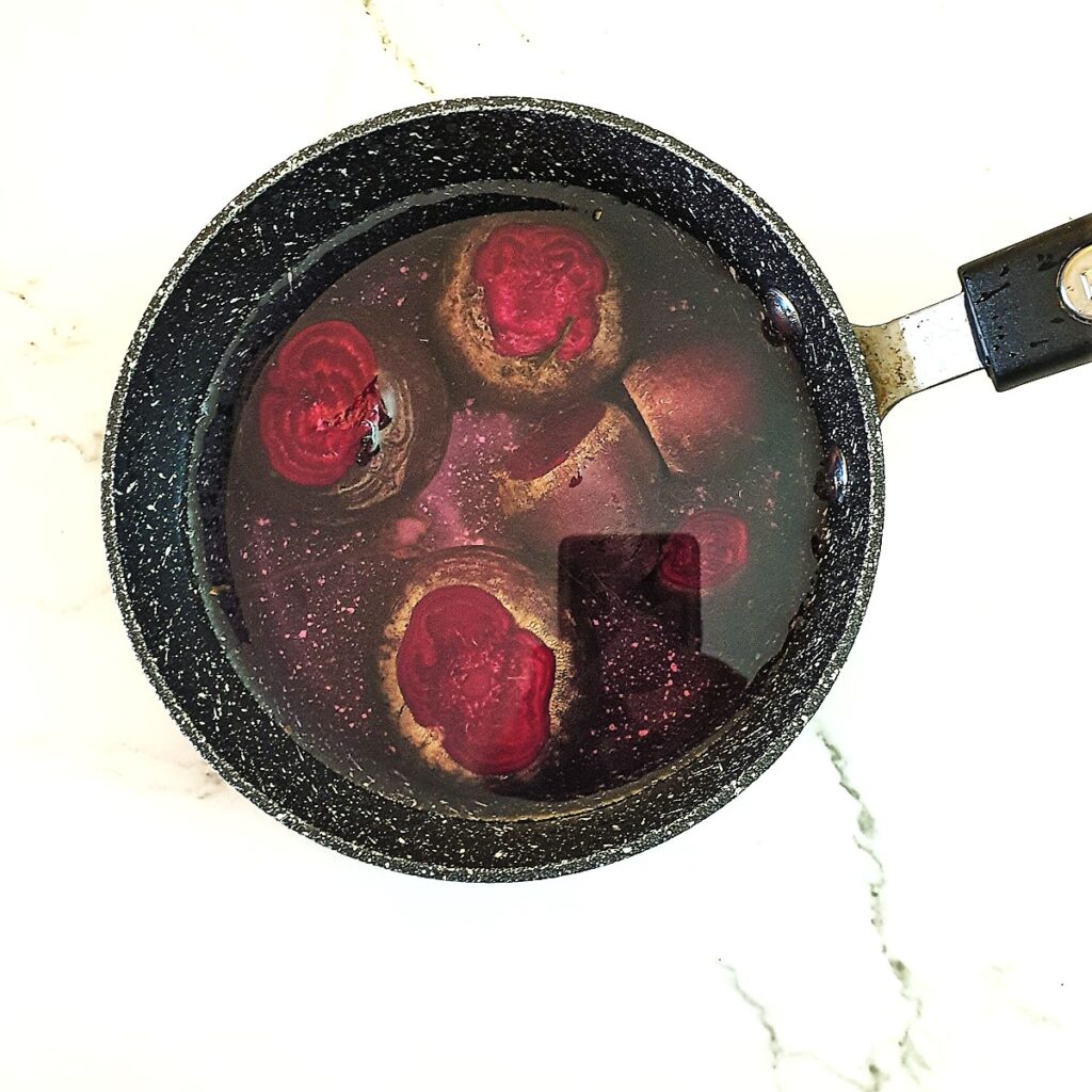 Beetroot in a pan of water.