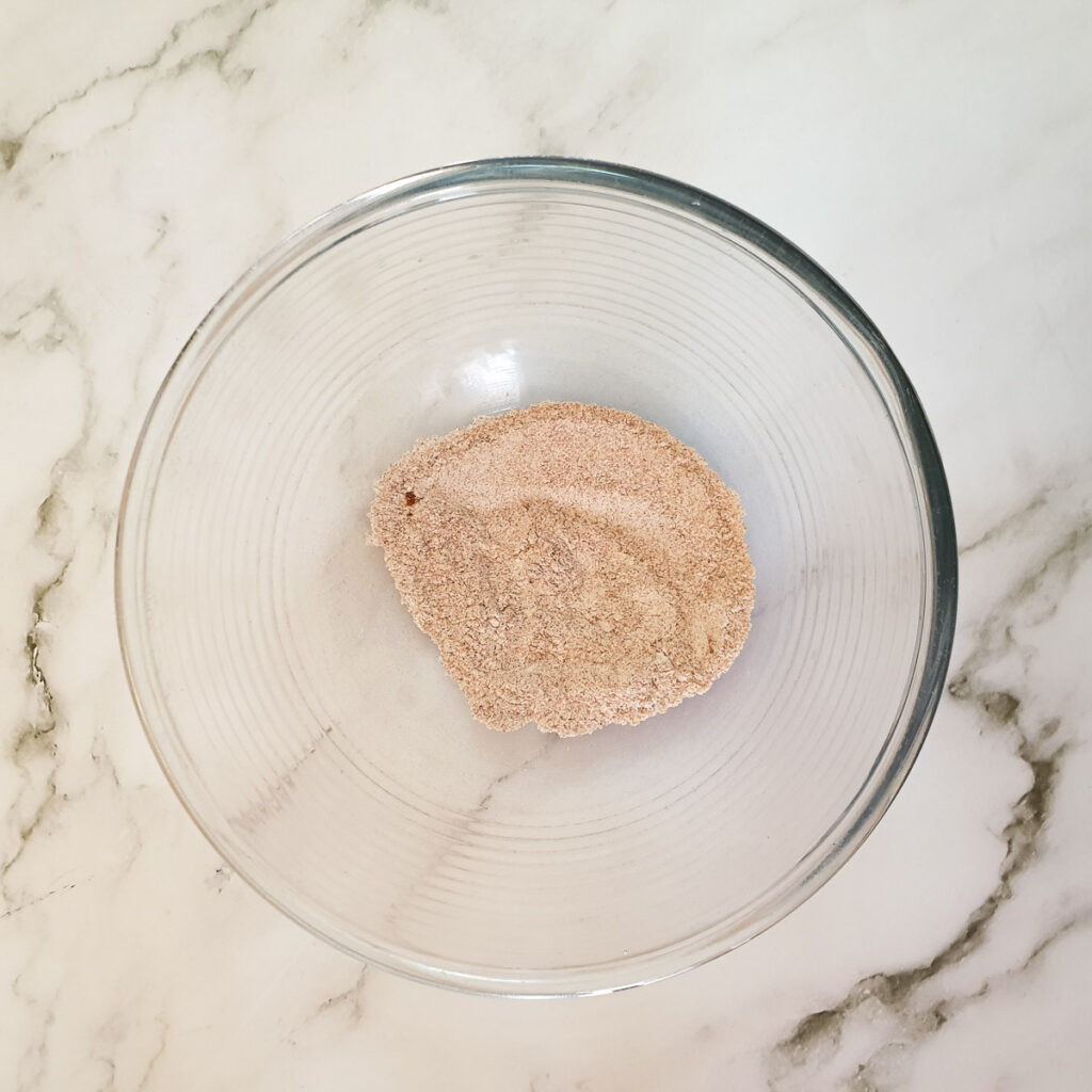 Flour, paprika and salt combined in a mixing bowl.