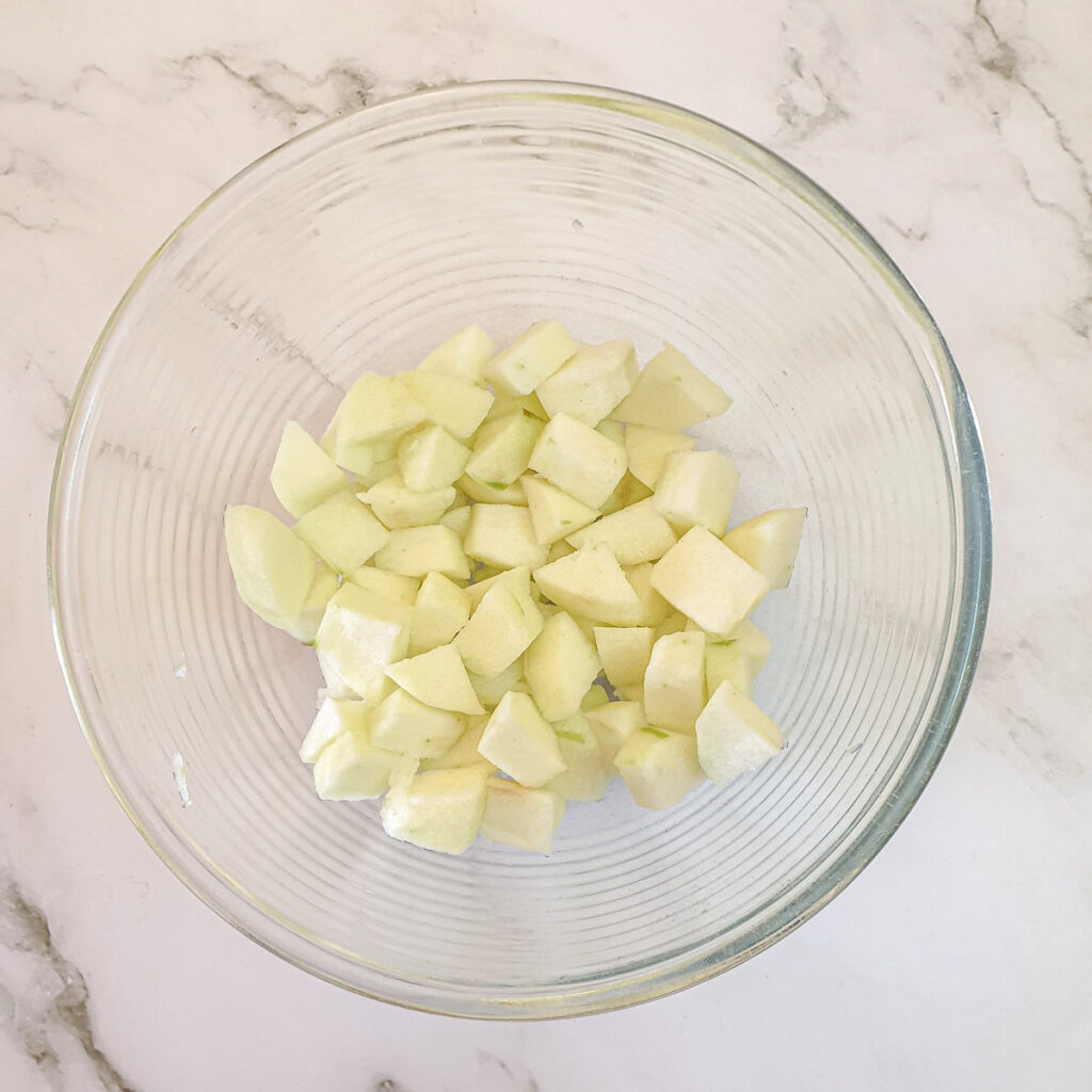 Diced apples in a mixing bowl.
