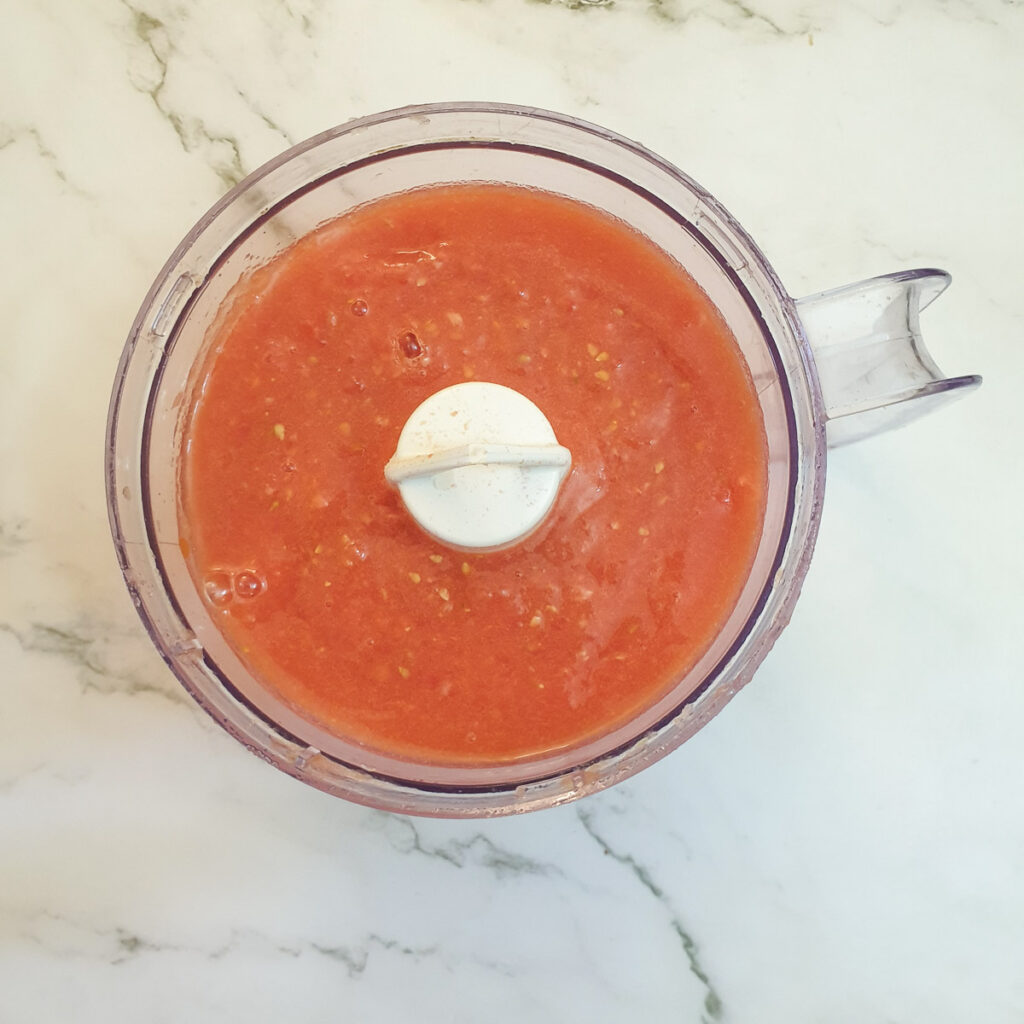 Liquidised tomatoes in a food processor