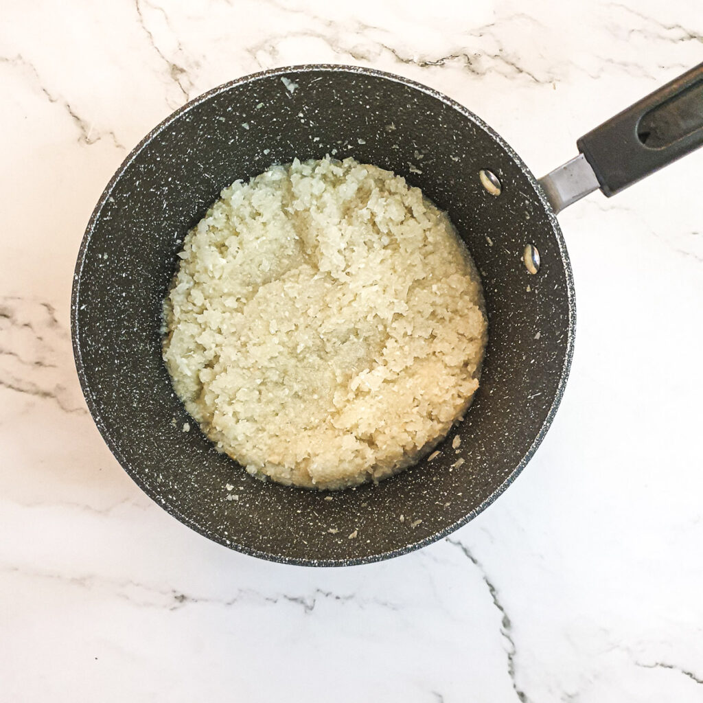 Chopped onions in a saucepan.