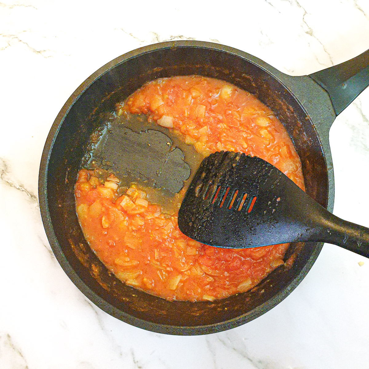 Cooked onions and tomatoes that have been cooked until the liquid has reduced.