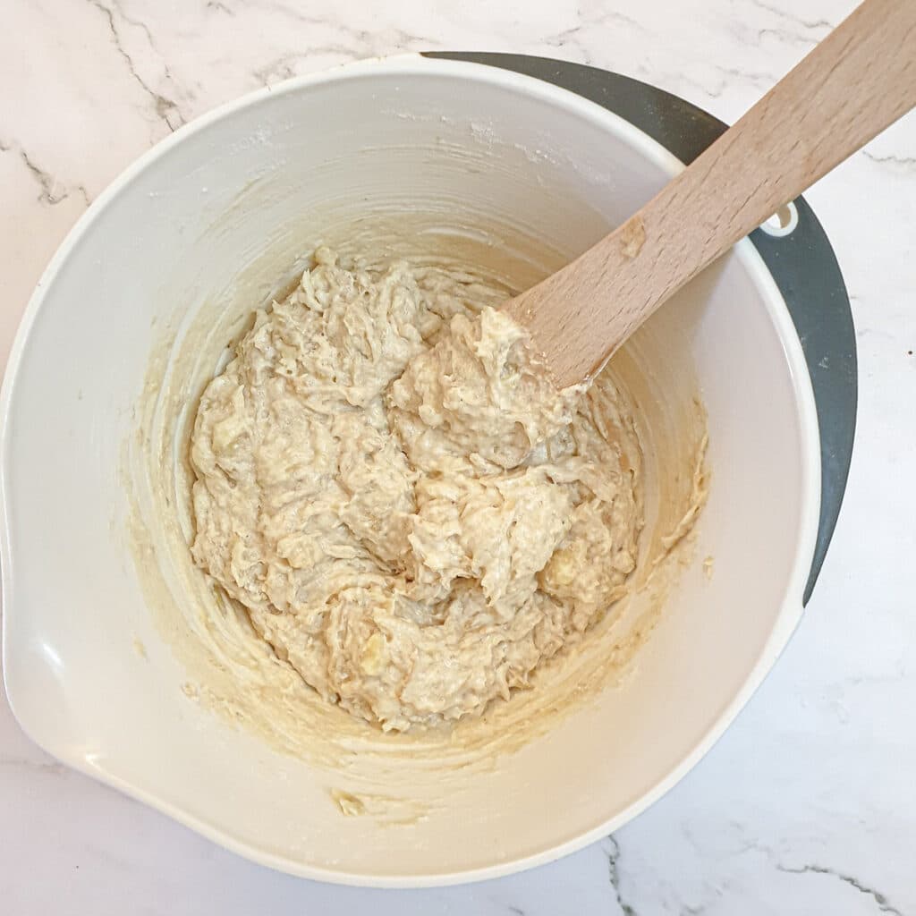 Pear and banana loaf batter in a mixing bowl.