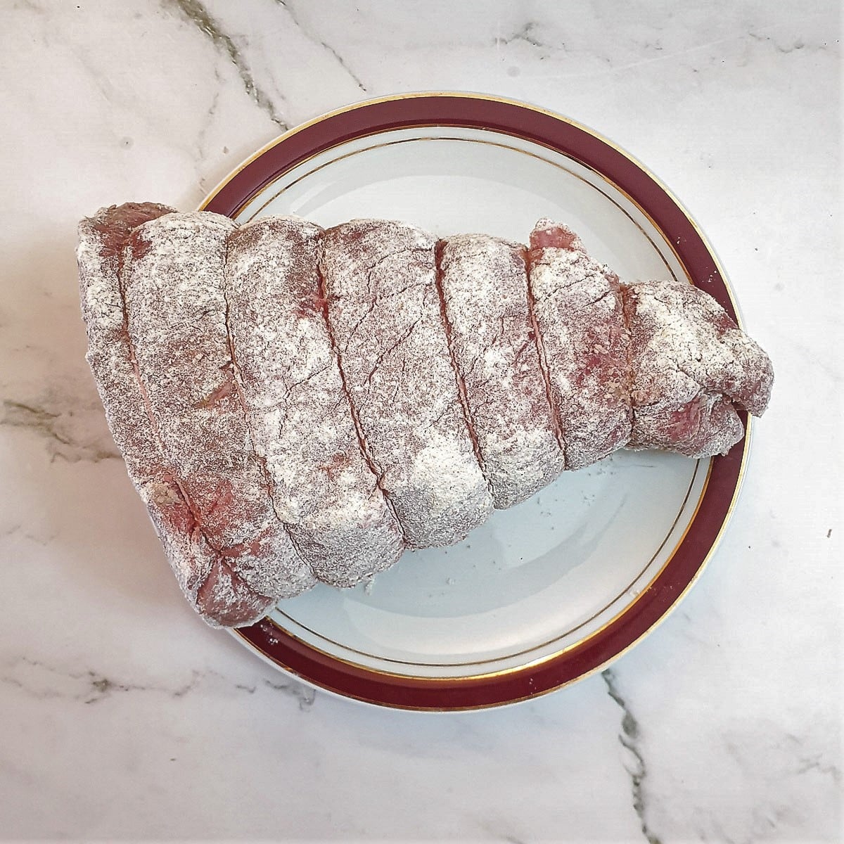 A joint of beef coated in flour.