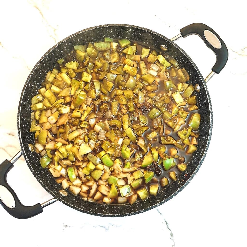 All the ingredients for green tomato chutney in a large pan.