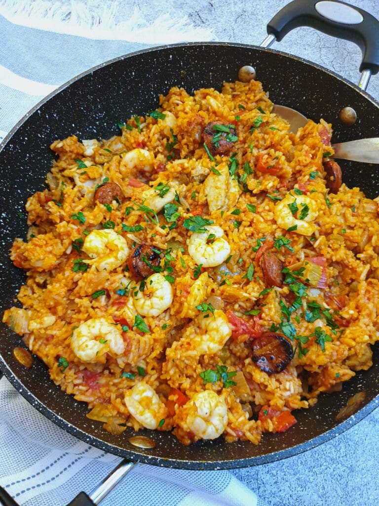 Overhead shot of a dish of Creole jambalaya, with prawns.