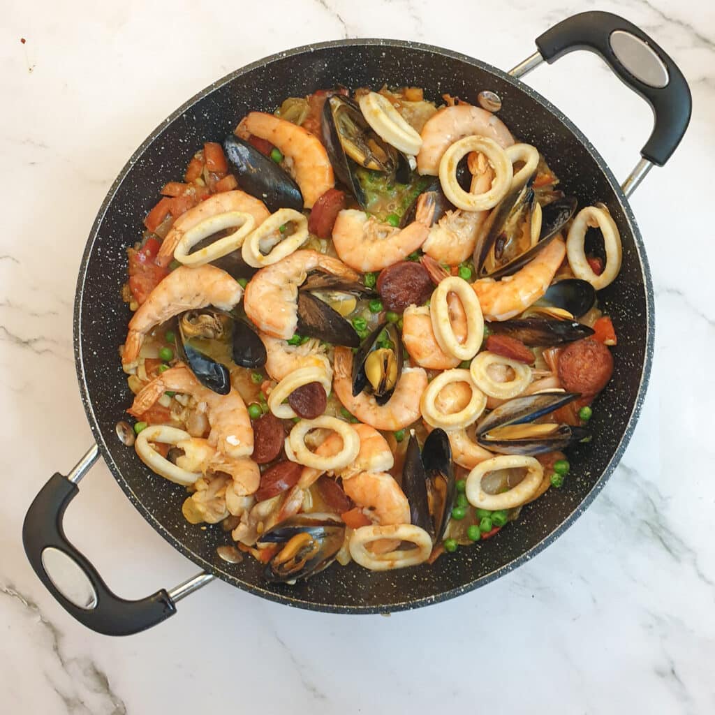 Overhead shot of the finished dish of Spanish paella.