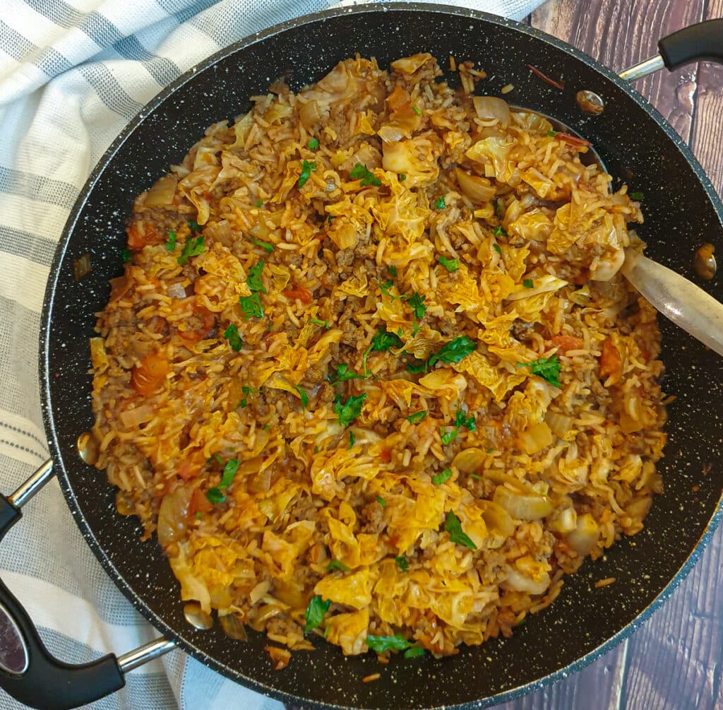 Unstuffed cabbage rolls in a frying pan.