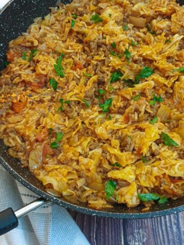 Close up of a dish of unstuffed cabbage rolls.