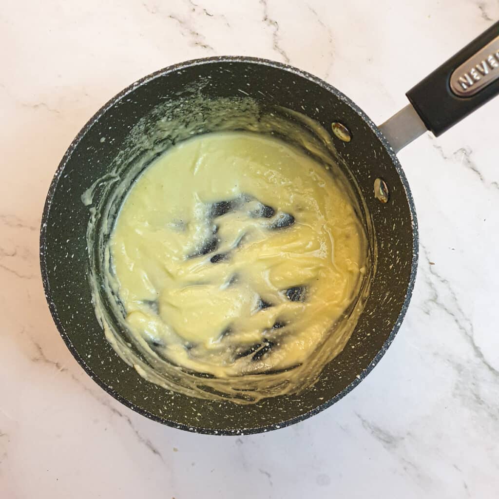 Butter and flour combined in a saucepan.