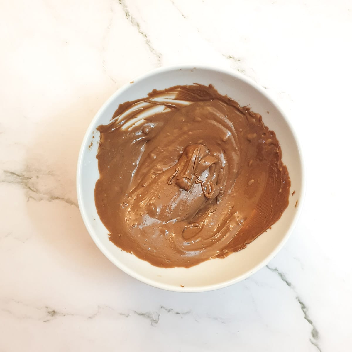 A bowl of melted chocolate.