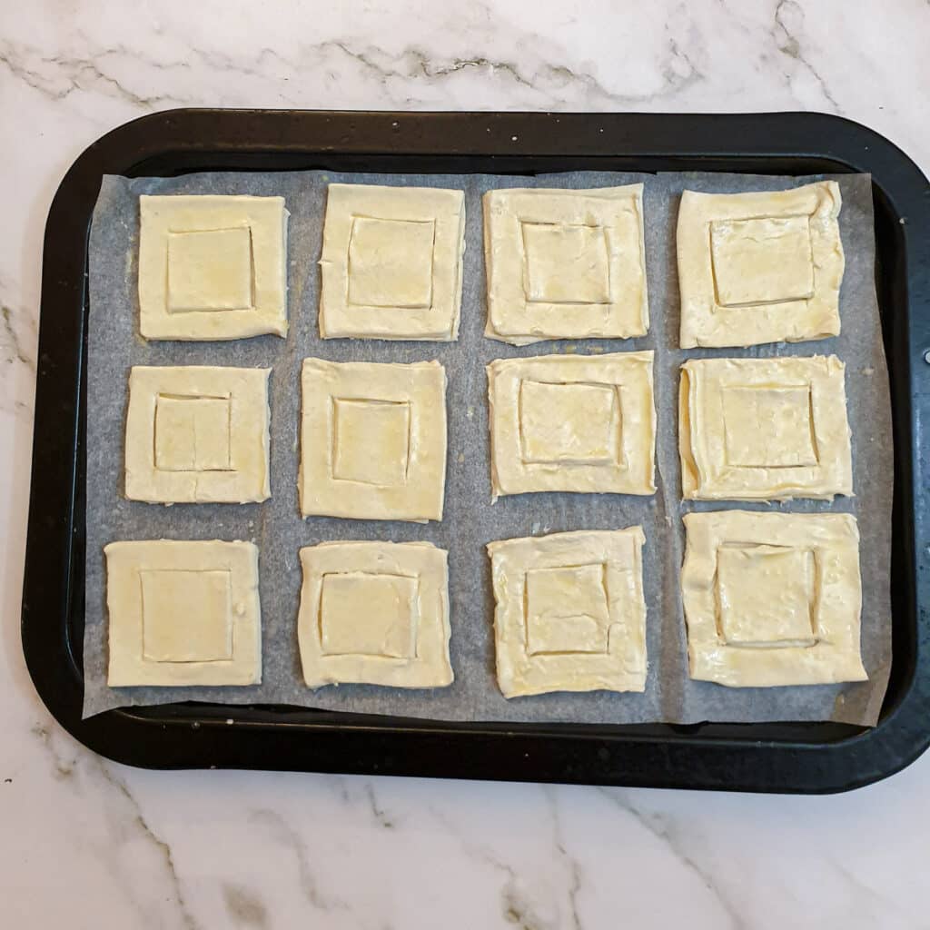 12 assembled vol-au-vent cases ready for the oven.