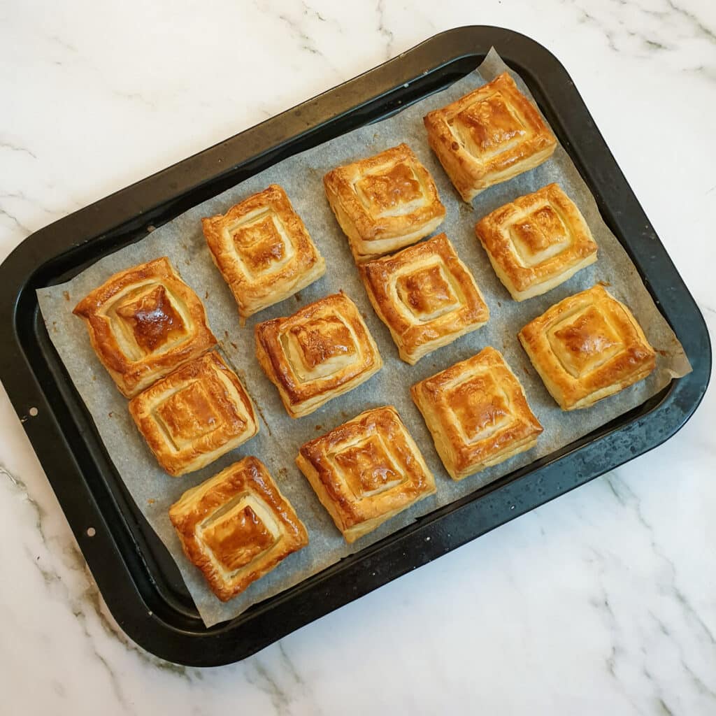 12 vol-au-vent cases on a baking tray