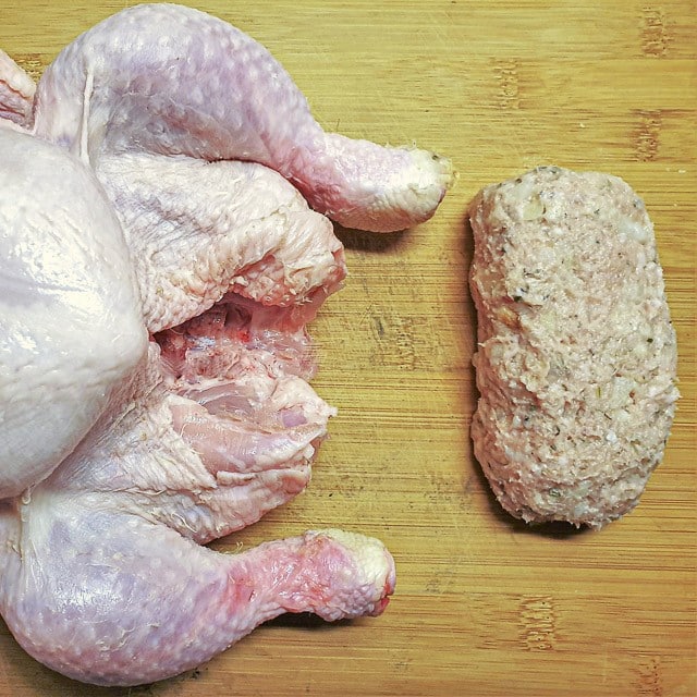 A roll of sage and onion stuffing ready to go inside a chicken.