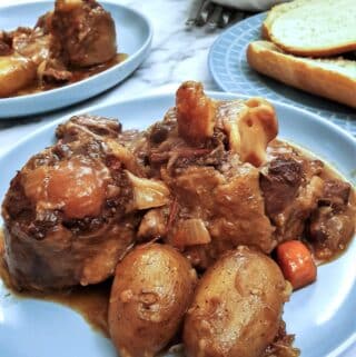 Closeup of a plate of slow-cooker oxtail stew.