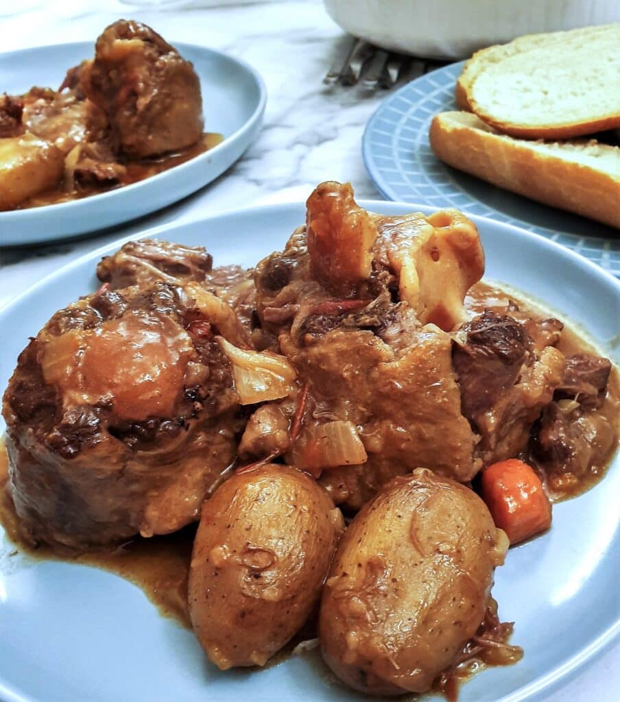Closeup of a plate of slow-cooker oxtail stew.