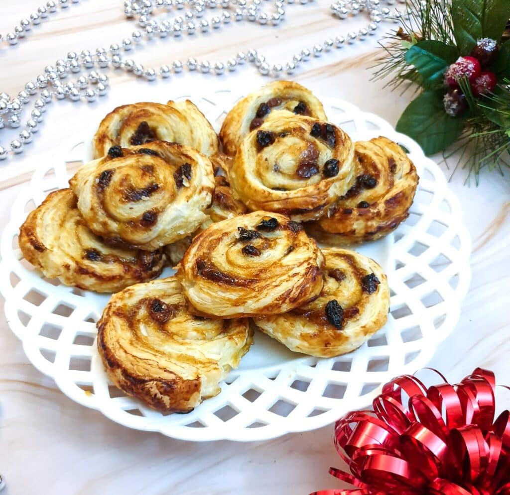 A plate of Christmas fruit pinwheels.