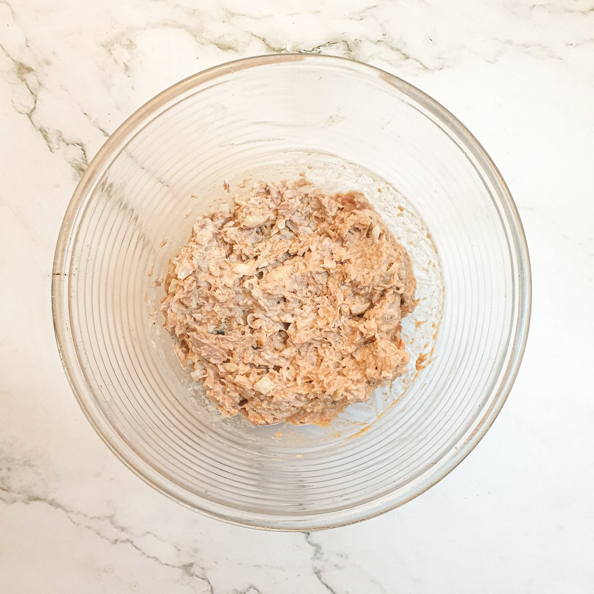 A mixing bowl containing a mixture of poor man's crayfish.