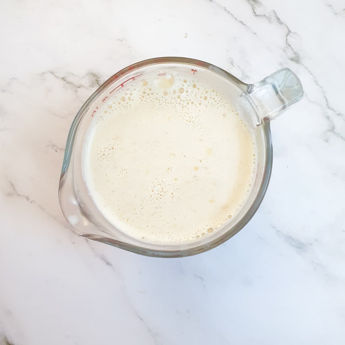 Custard in a measuring jug.