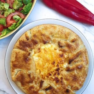 A Tex Mex beef pie showing the crispy pastry around the edge and the golden melted cheese in the middle.