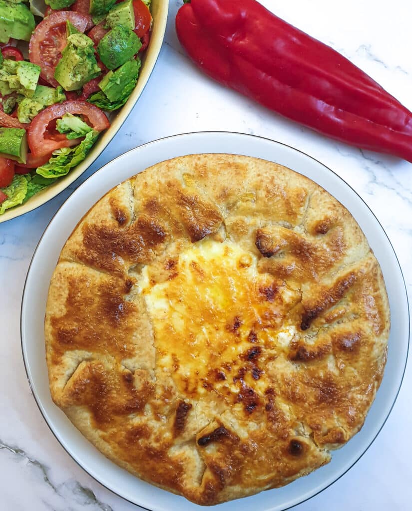 A Tex Mex beef pie showing the crispy pastry around the edge and the golden melted cheese in the middle.