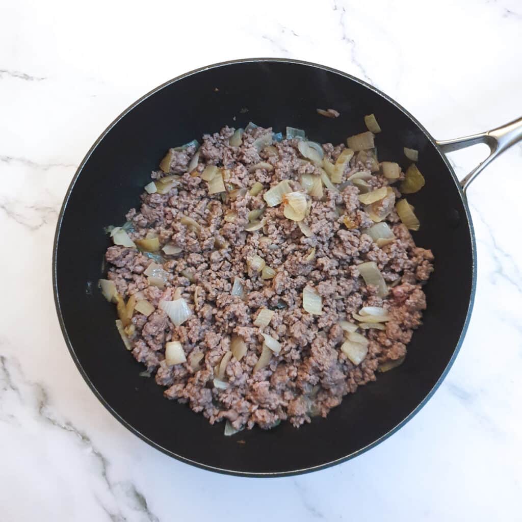 Ground beef browning with the onions.