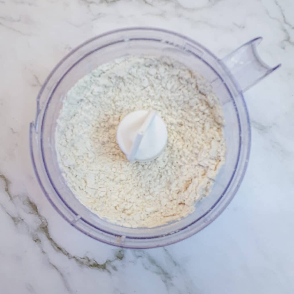 Flour, butter and walnuts processed to a breadcrumb state in a food processor.