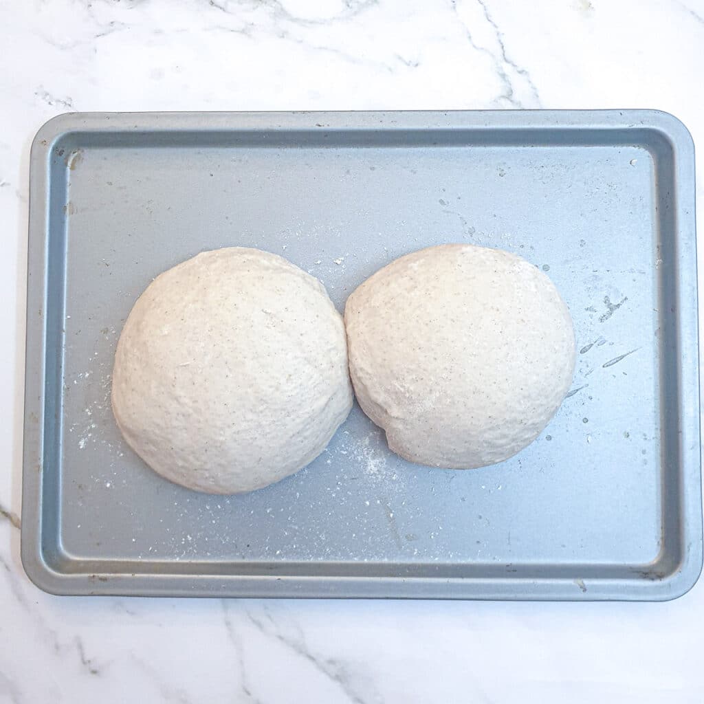 Two balls of dough ready to be rolled into pide.