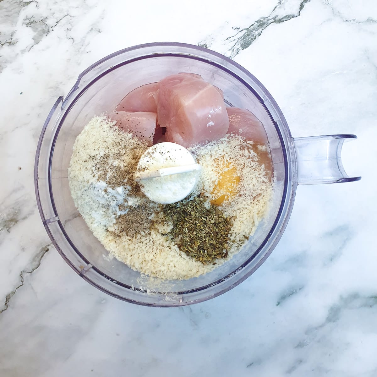 Ingredients for the chicken filling in a food processor.