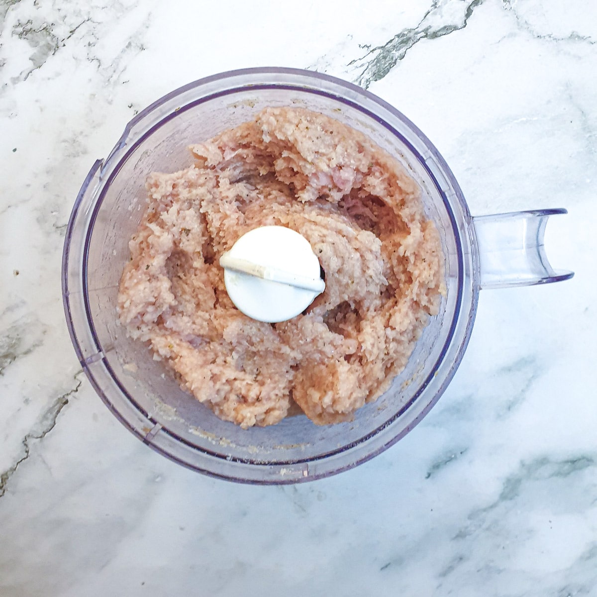 Minced chicken in a food processor.