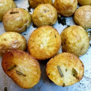 Close up of crispy roast baby potatoes showing the golden brown underside.