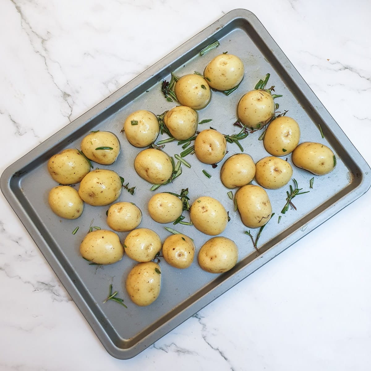 A tray of baby potatoes ready for the oven.