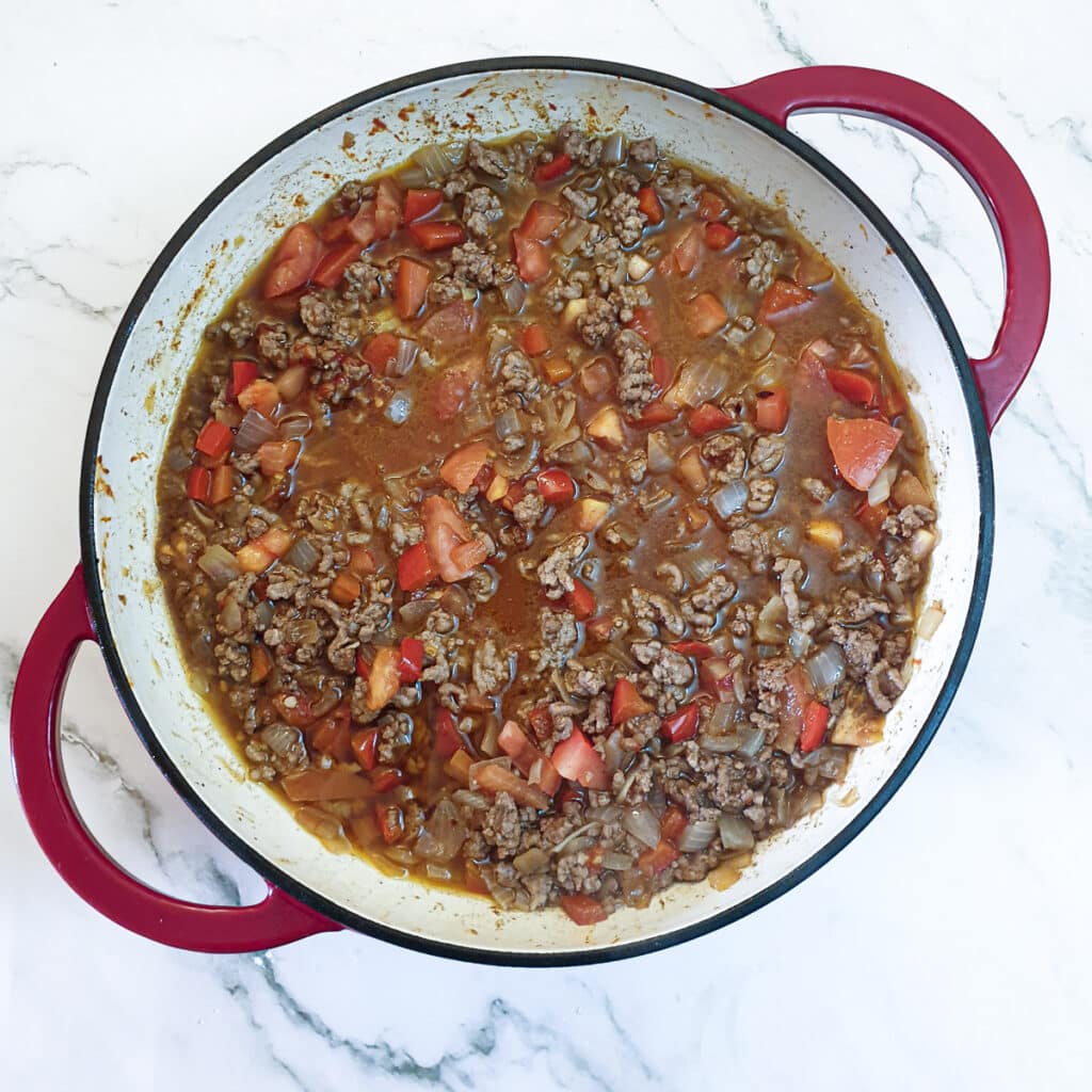 A dish of lamb keema with stock added.