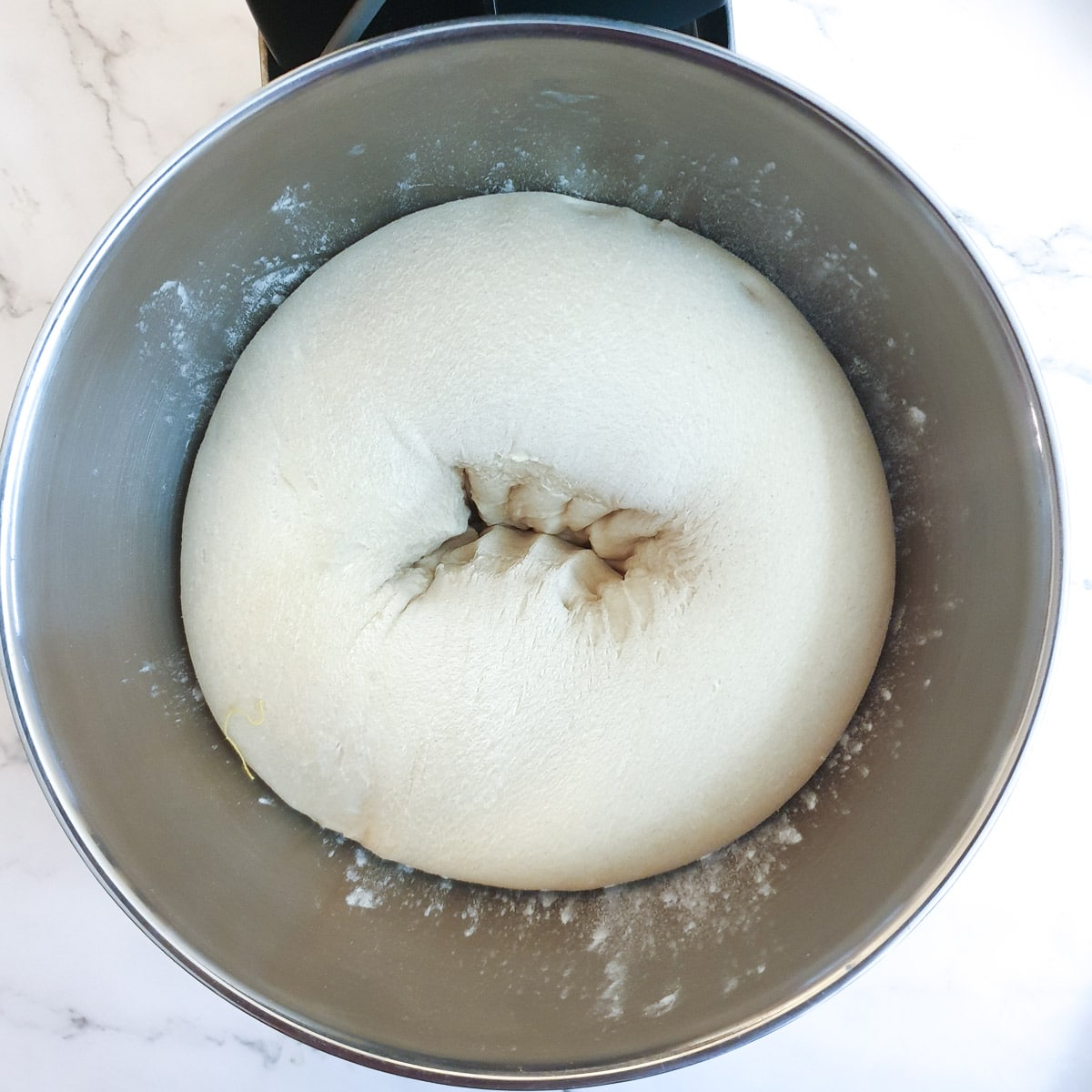 A ball of dough being punched down.