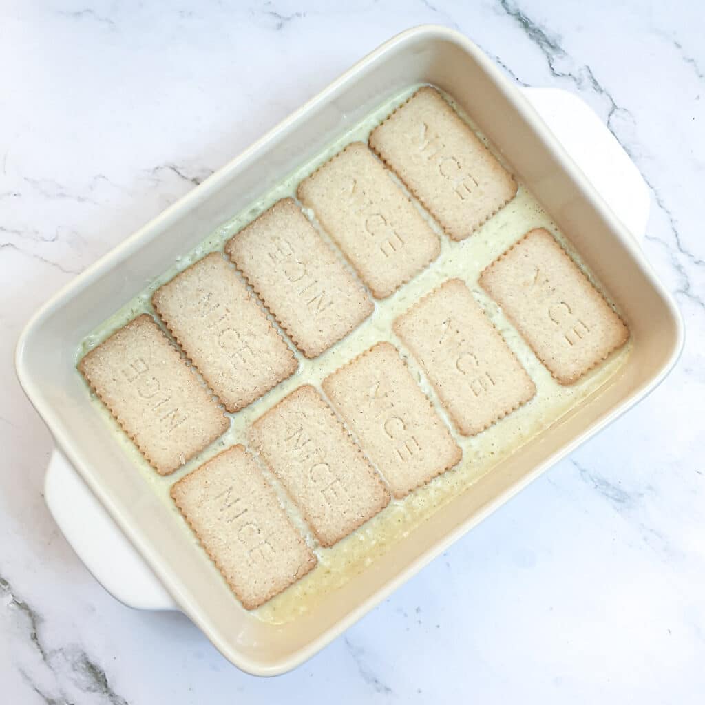 A second layer of biscuits added to the pudding.