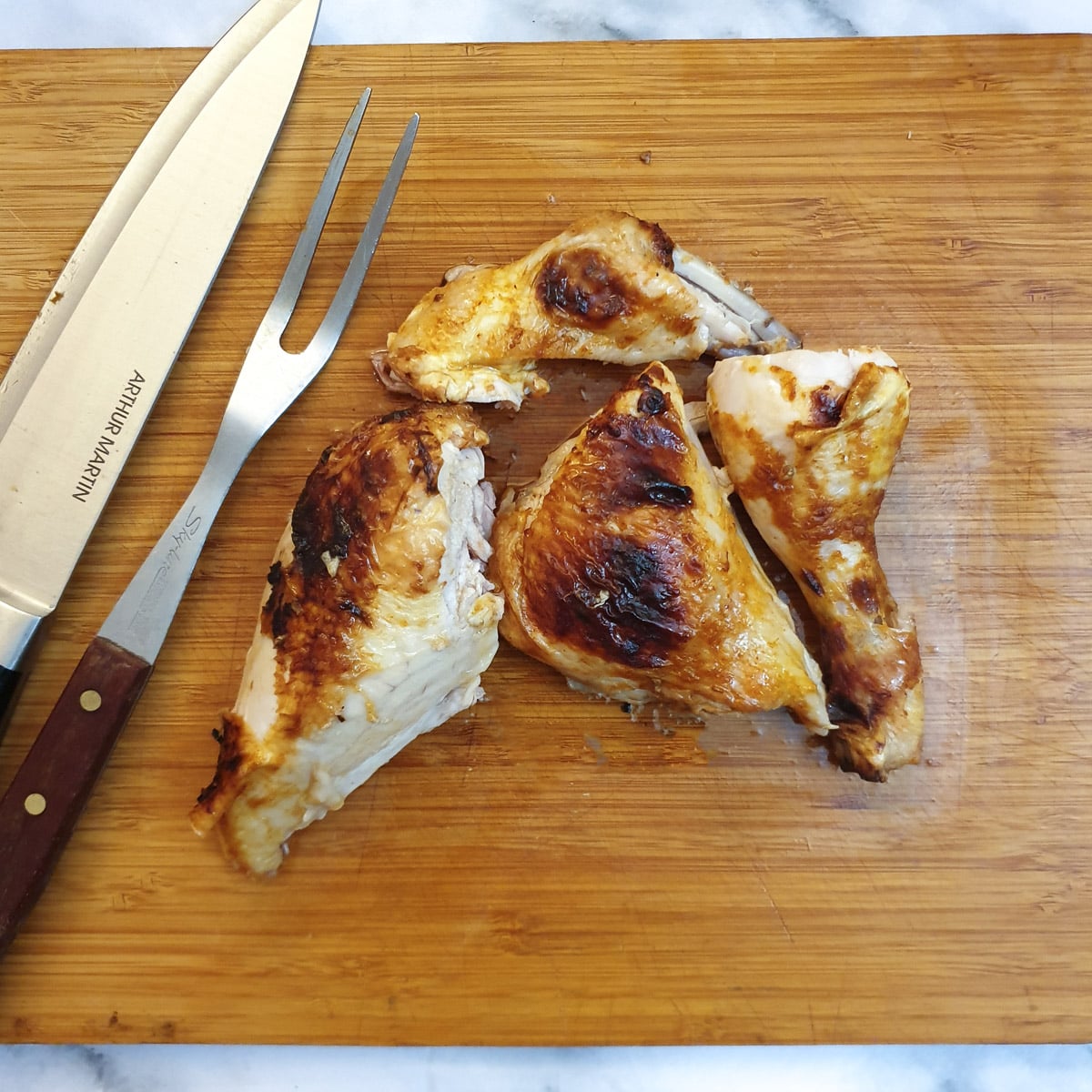 Half a spatchcocked chicken cut into 4 pieces.