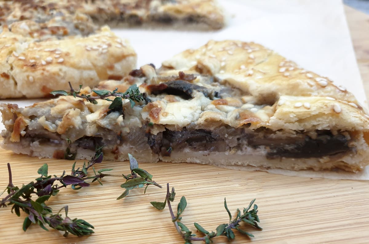 Side-on view of a slice of mushroom galette.