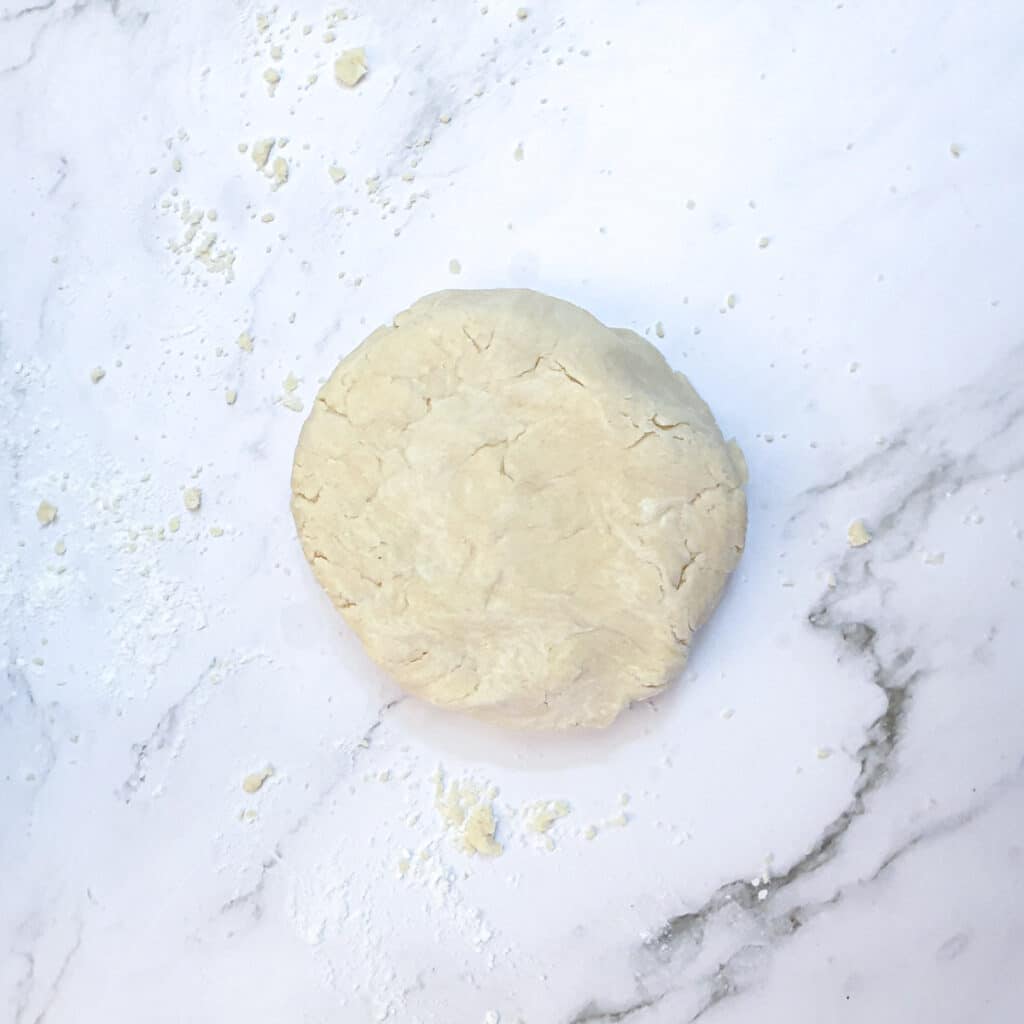 A ball of dough on a work surface.