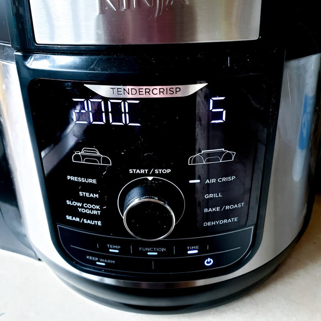 A Ninja multi-cooker showing the settings for preheating.